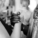 hands holding with difference of opinion practicing empathy