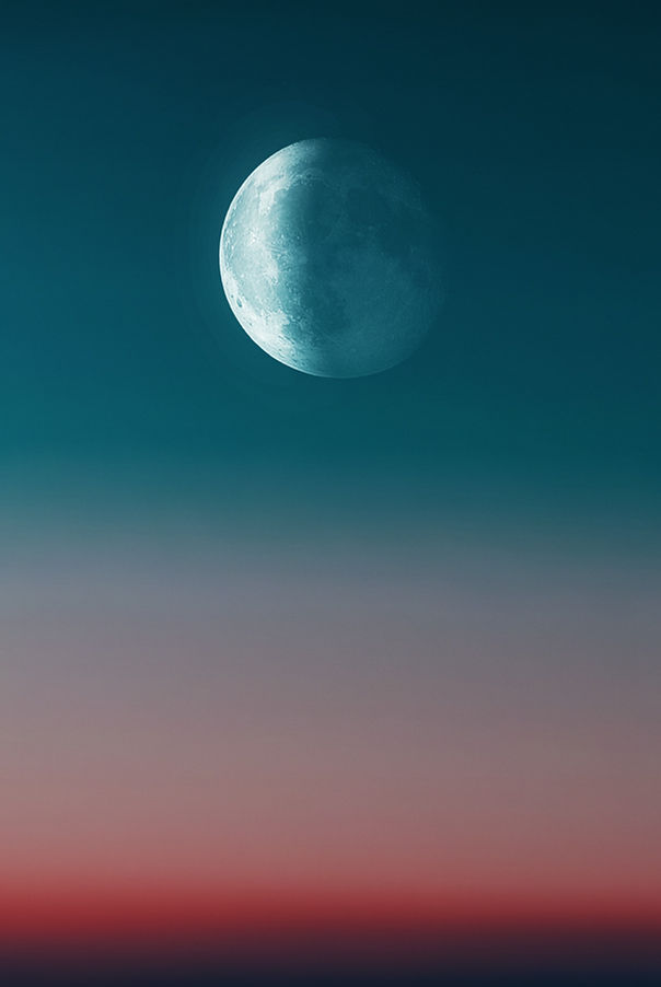 Moon in teal sky above a gradient horizon of pink and red, creating a serene and tranquil mood.