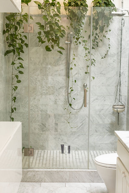 tiled wet room with plants hanging down