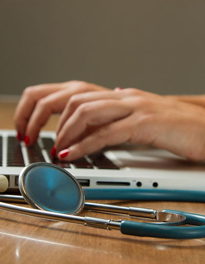 Medical Practioner Working on Laptio