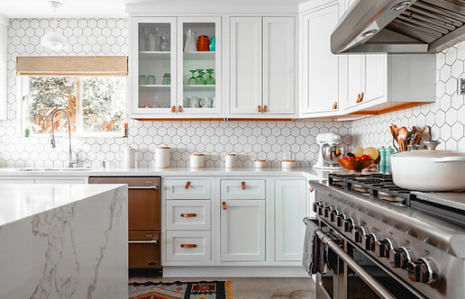 Kitchen Remodel With White Mission Cabinetry And A Marbled White Quartz Countertop Which Waterfalls Over The Edge