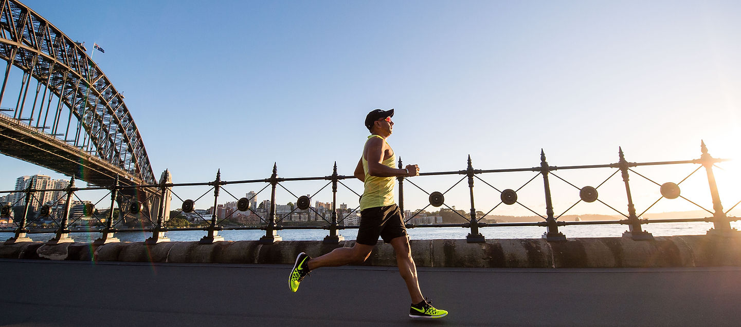 A runner crossing a bridge alone, symbolising clarity and purpose in the race.