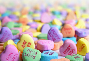 Heart shaped candies with various phrases written on them