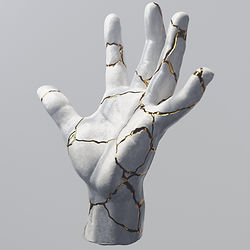 Cracked marble hand sculpture with gold veins