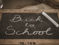 A blackboard that reads "back to school"