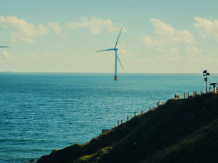 Wind turbines in the ocean, offshore wind energy expansion on the sea.