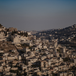 Dense stone houses of the Silwan neighborhood in East Jerusalem. A view of the historic village built on the steep slopes of the Kidron Valley near the City of David.