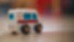 Zoomed in on toy first responder vehicle, background blurry