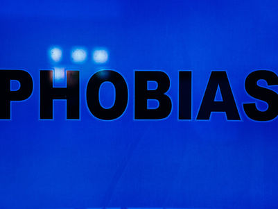Blue background with the word ‘PHOBIAS’ highlighted, representing fear and the importance of phobia therapy in Dubai.