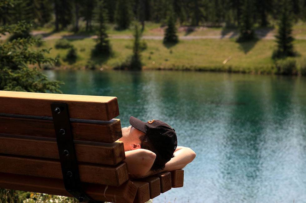 Athlete resting outdoors in Vermont representing planned rest and recovery days as essential components of a long-term athletic training program