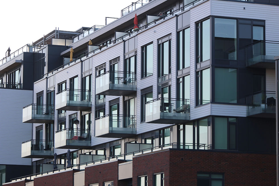 Australian strata apartment building with private balconies, a shared entrance and landscaped common areas.