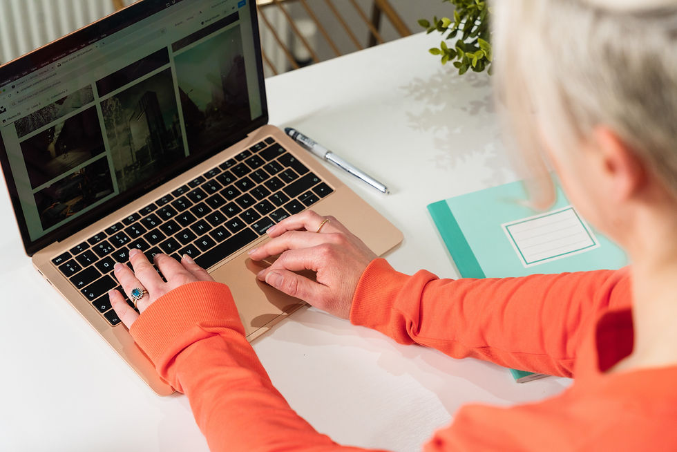 woman typing on macbook