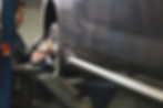 Mechanic mounts new tires on a vehicle during a tire replacement service