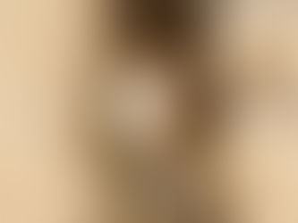 a cat tucked into a stone niche, sunny day, watching the world go by