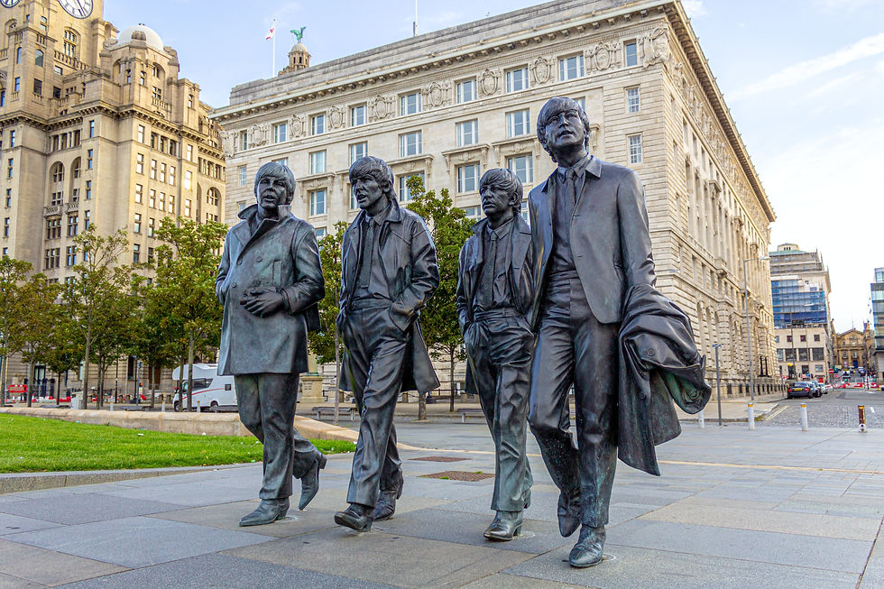 Statues of the Beatles in Liverpool city center.