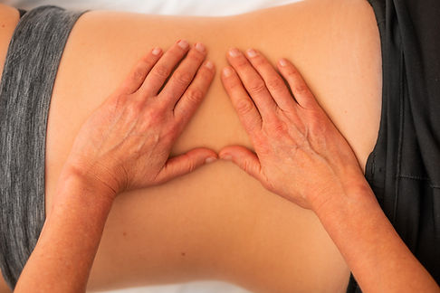 physiotherapy treatment, physio's hands on a patients back
