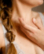 a realistic image of a patient holding his throat because he is sick.jpg
