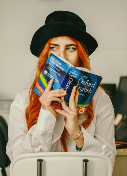 A person holding a dictionary