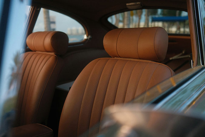 Clean brown leather car seats shown as part of add-on detailing options in Scottsdale.
