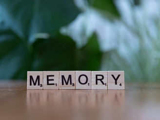 Scrabble tiles making up the word memory as an illustration of a memory assessment clinic in relation to a dementia diagnosis.