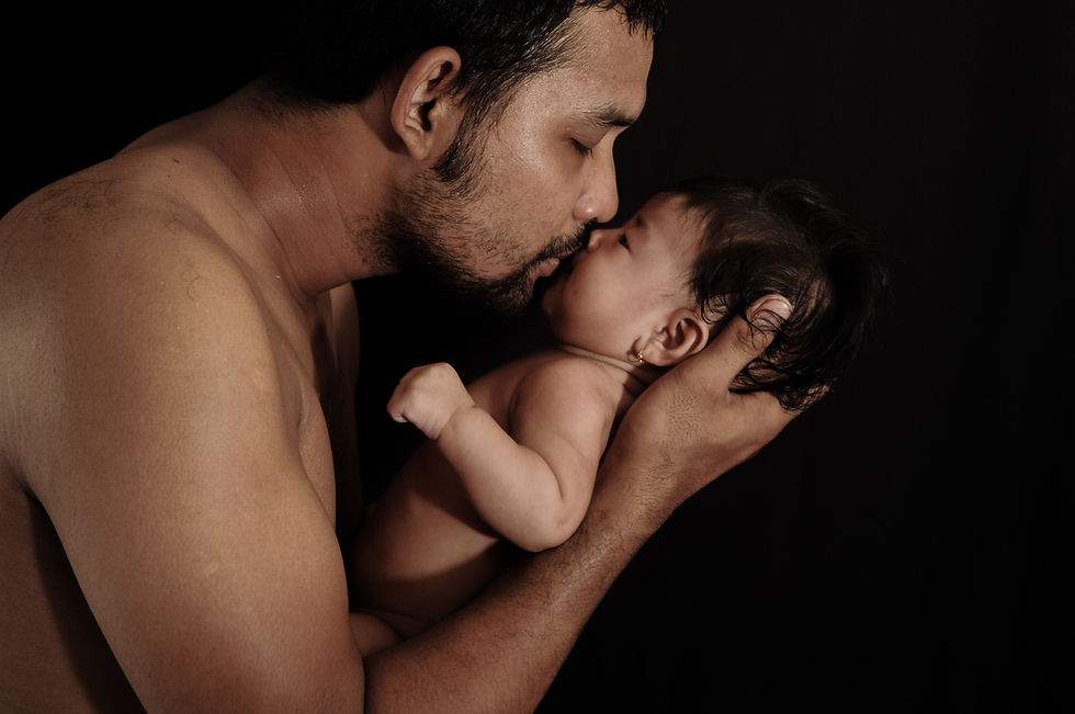A gay dad with his baby representing What Is Fertility Equality? Creating a Fairer Path to Parenthood