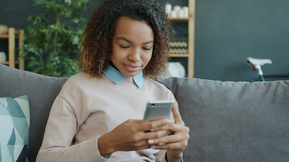 Homebuyer using a smartphone to research mortgage loan officers online
