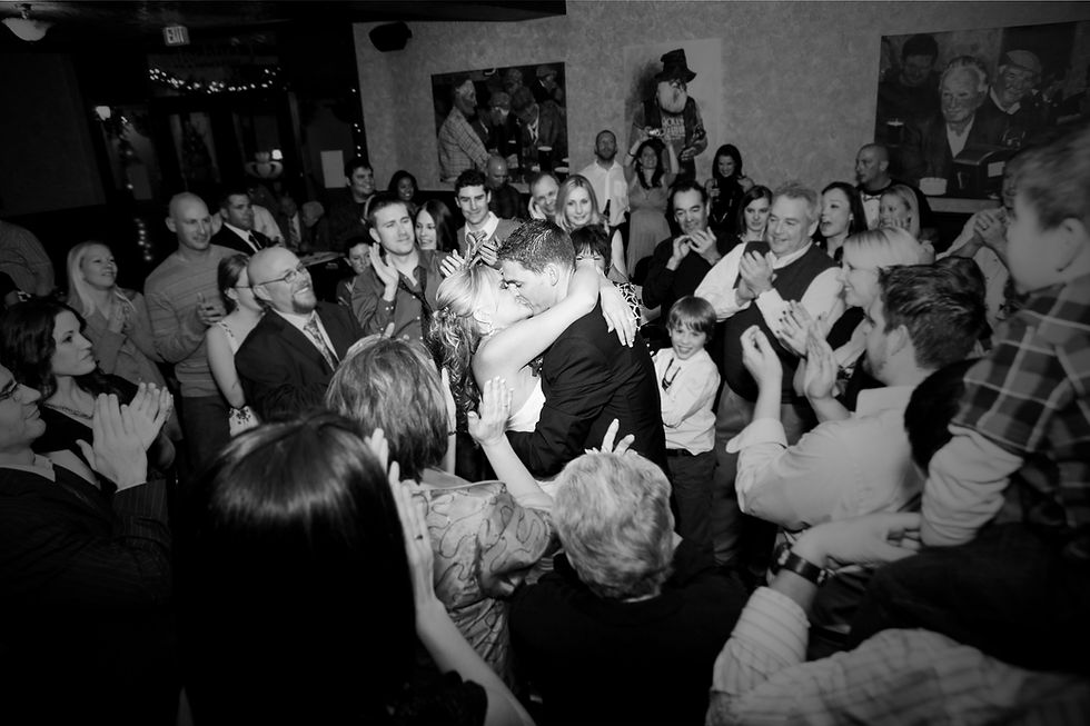 Bride & Groom shares a kiss in black and white