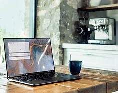 Computer and coffee mug