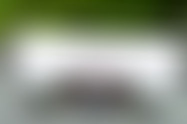 An old-fashioned typewriter with a sheet of paper showing the word “HISTORY,” symbolizing the journey that led to today’s thriving Thai GL industry.