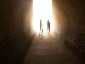 women's shadows in a tunnel