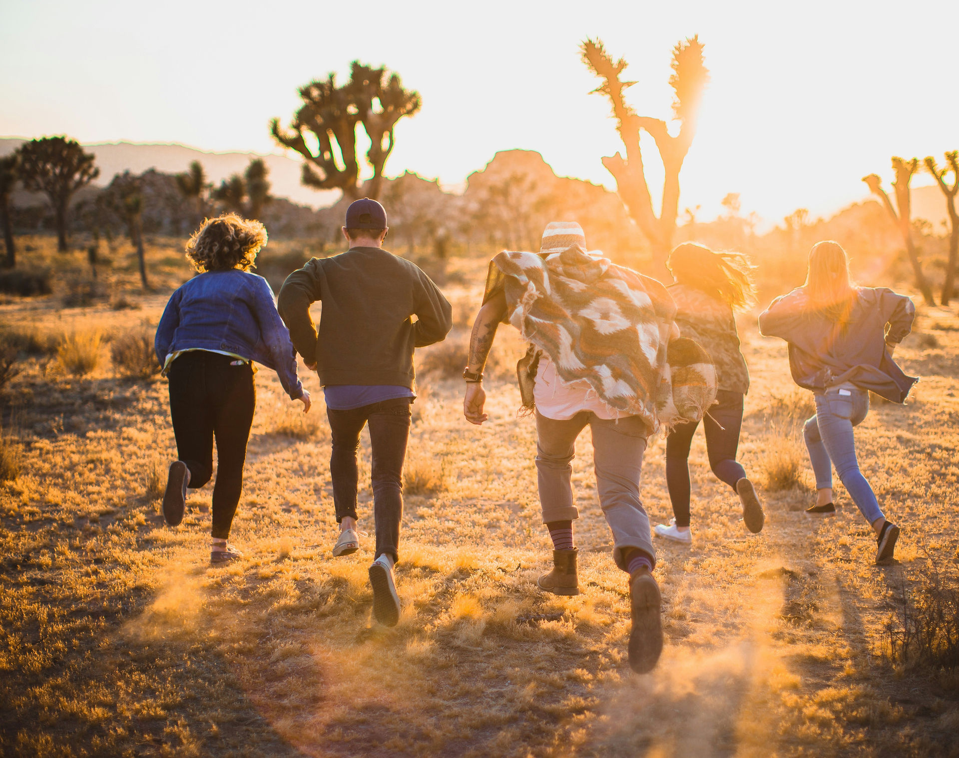 Friends running in the sunshine