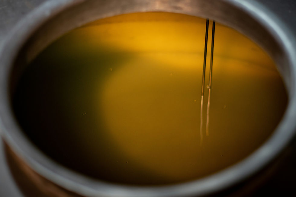 Pot of olive oil for natural soap