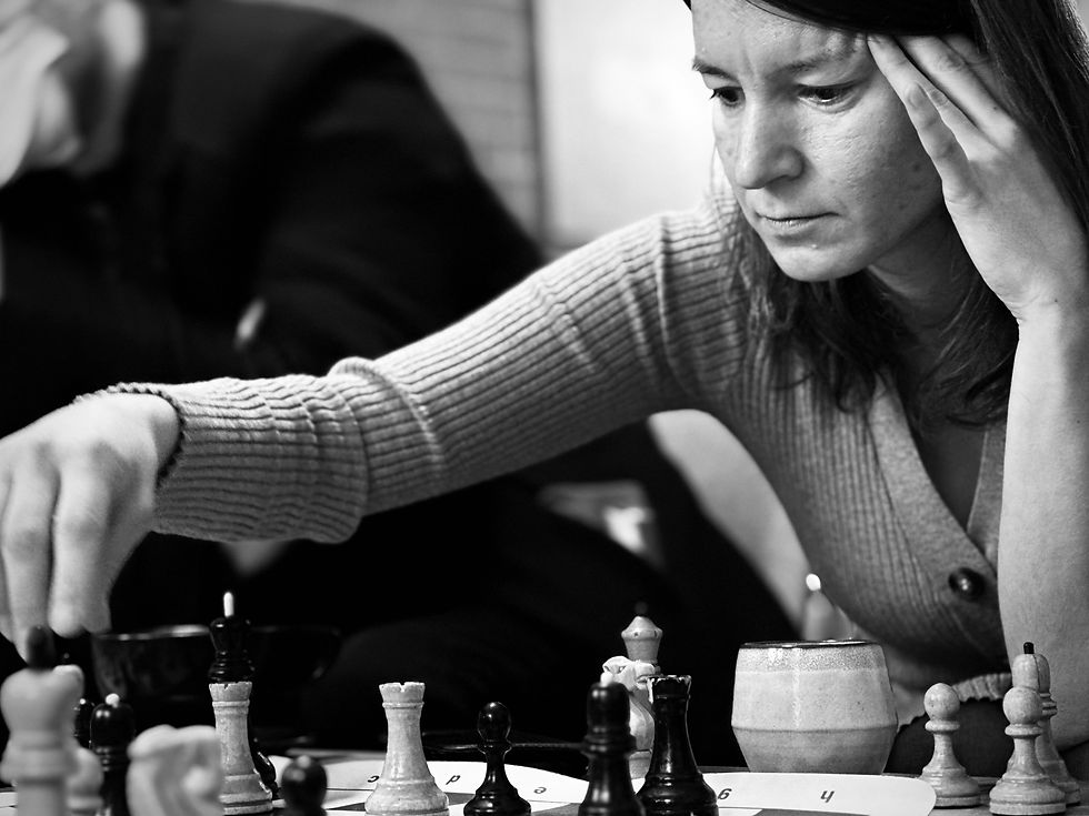A woman playing chess