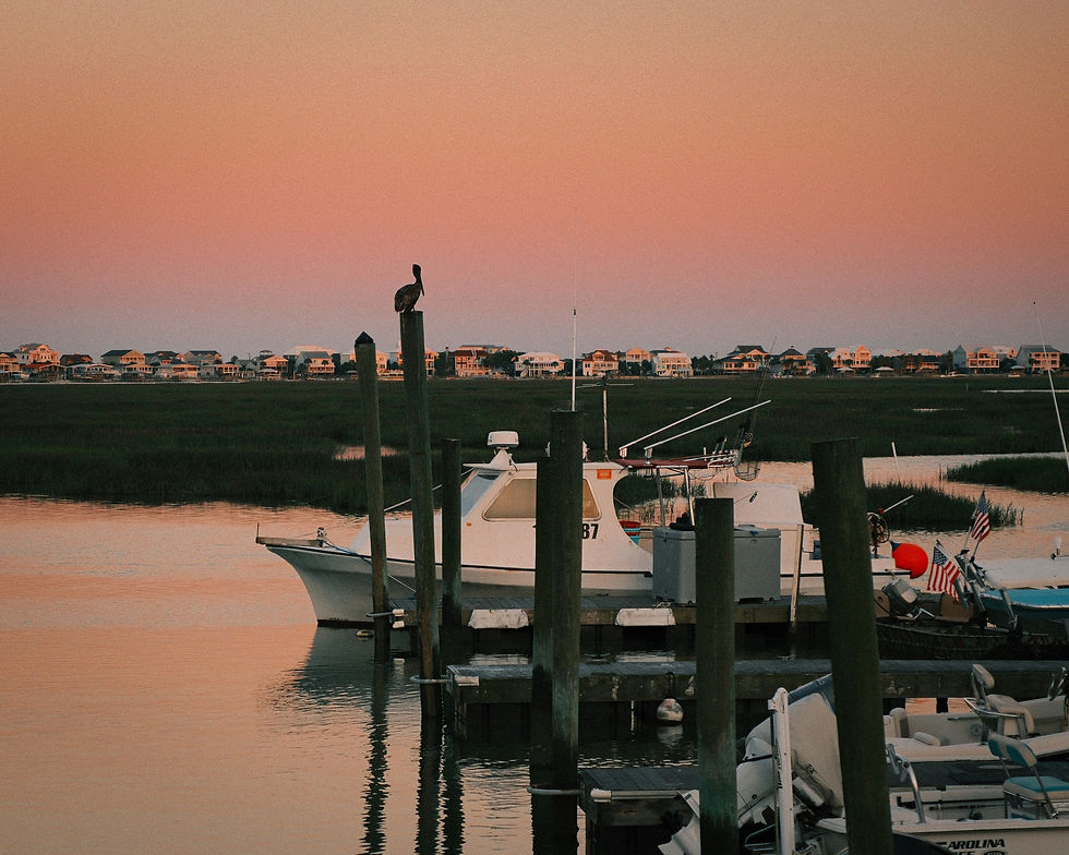 Boat docked on a marsh creek at sunset near the Shallotte River, NC