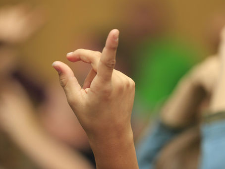 hand forming the letter D