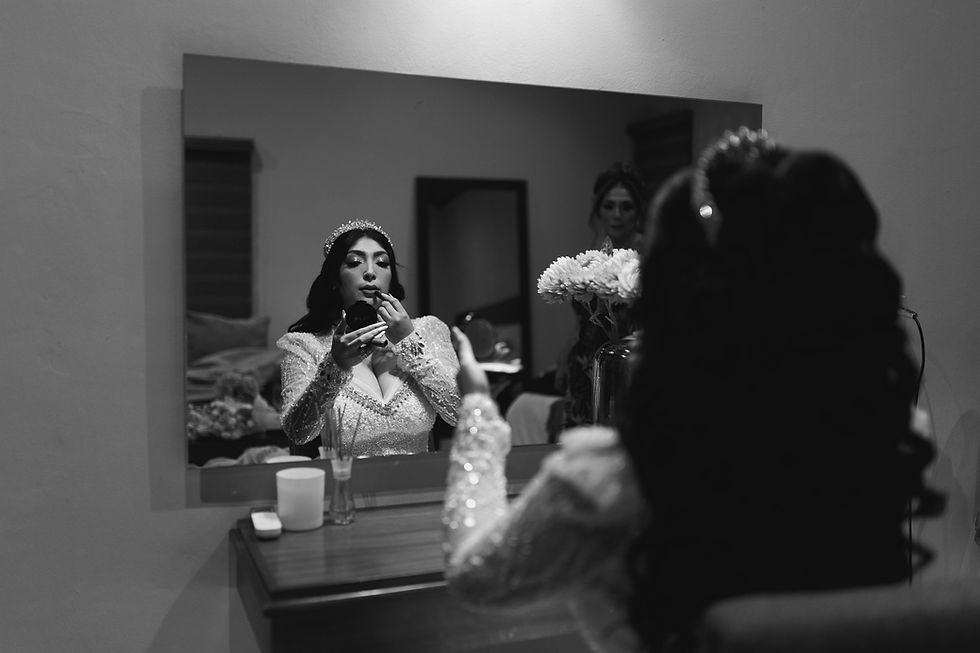 Bride in a wedding dress sitting the lipstick night before her wedding