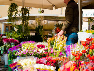 Flower shop owner using a CRM for florist business to track orders and deliveries