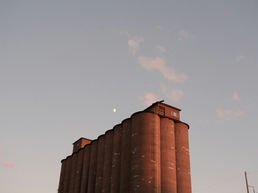 silos line a building