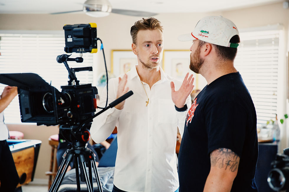 Video director training tech volunteer on cameras functions