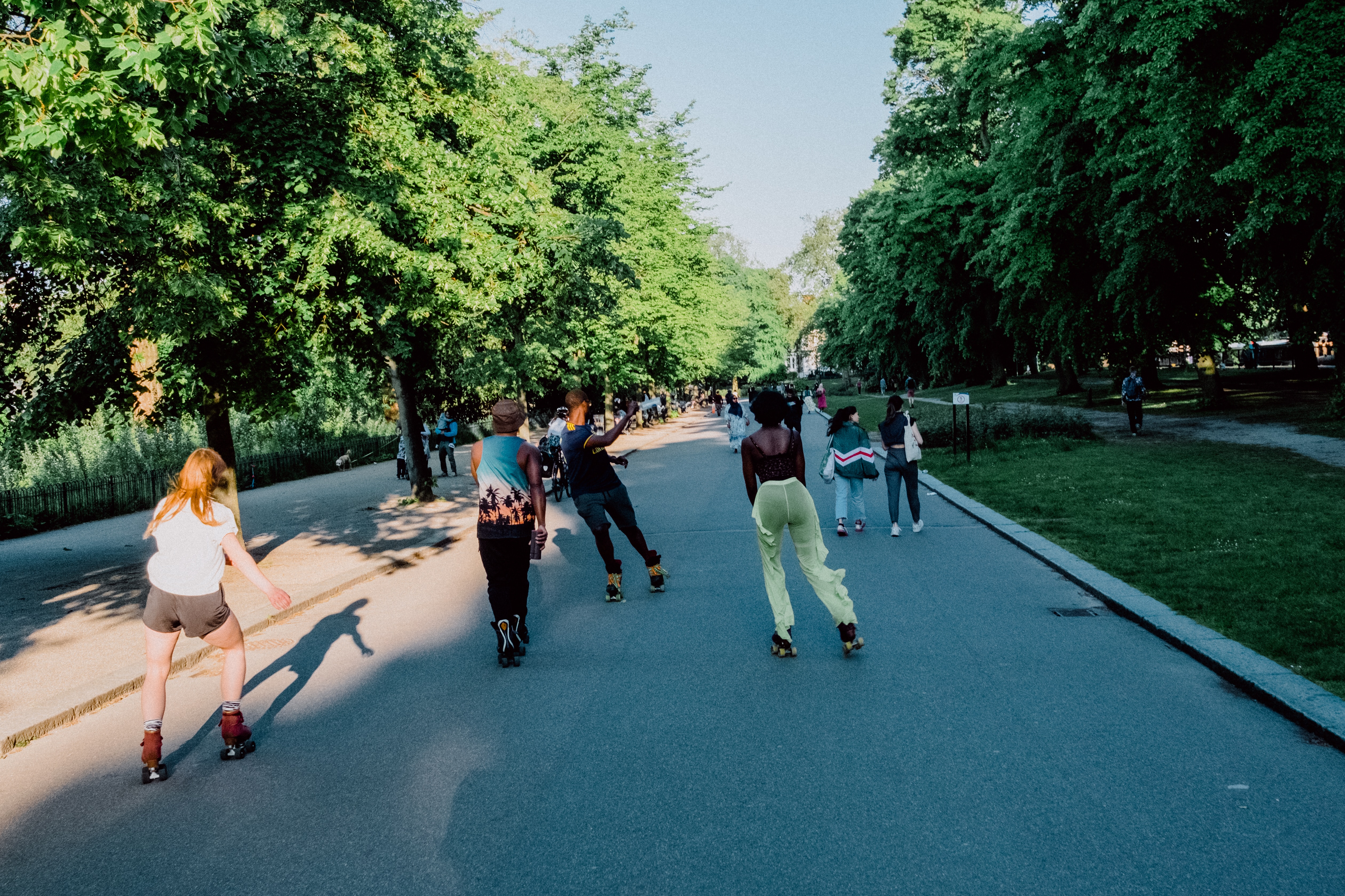 Group of roller/ quad skaters trail skating outside