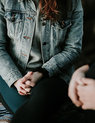 Close-up of a client’s hands during a counselling session