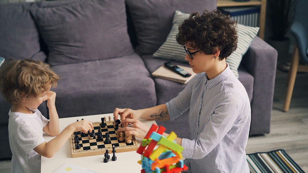 A young child and an adult are engaged in an intense chess match in a cozy living room, surrounded by colorful toys and a comfortable couch, fostering a moment of learning and connection.