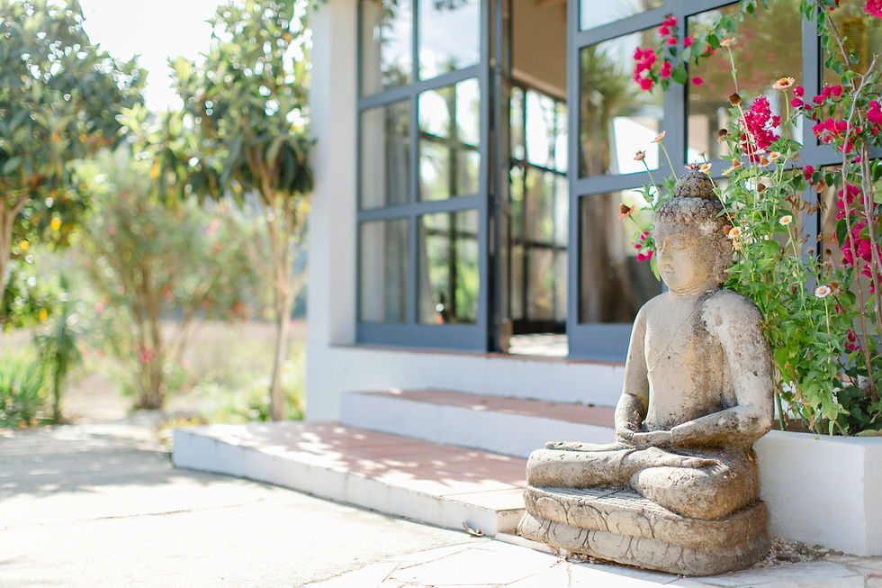 Buddha statue on a patio for retreat planning.