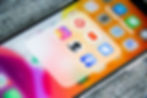 Smartphone screen showing a 'Social Media' folder with icons for Pinterest, Instagram, Clubhouse, YouTube, Twitter, and Facebook.