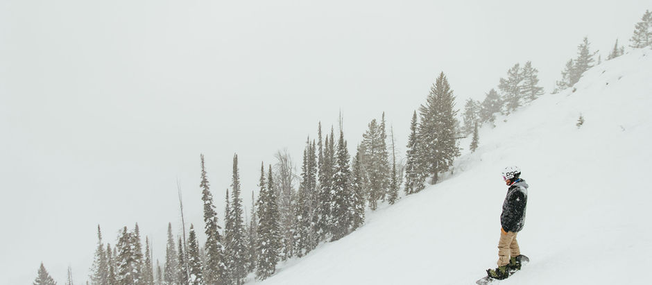 Man Skiing down a snow slope in solitude, deep in his own thoughts. 