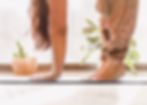 a woman doing yoga stretches at home