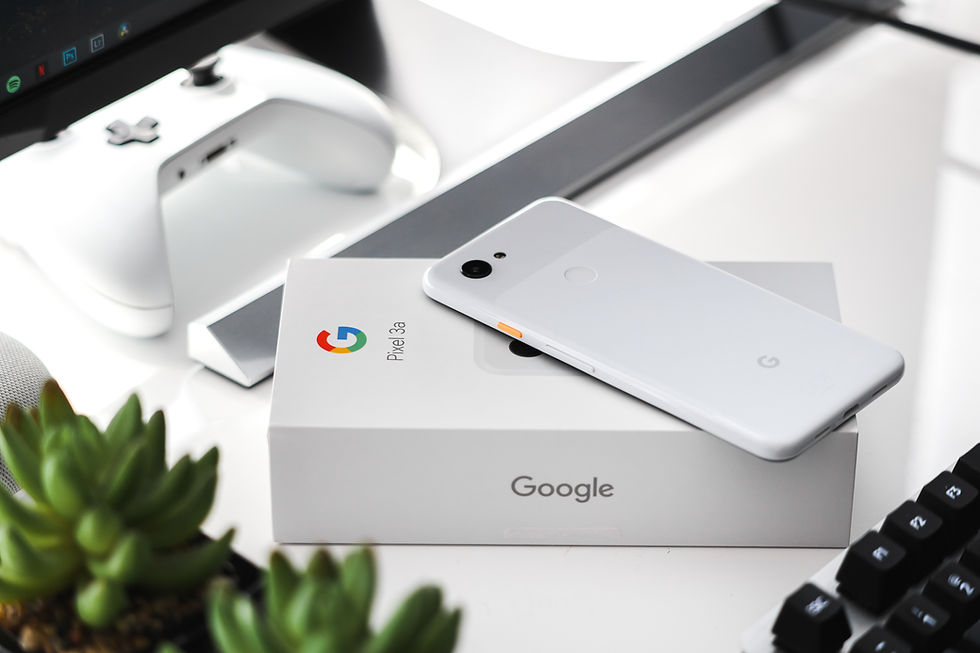Google cellphone on top of a box with the google logo