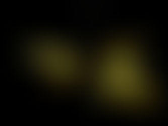 Yellow street signs for Tyers St, Percy St, and Tourist Drive illuminated against a dark night sky, creating a stark contrast.