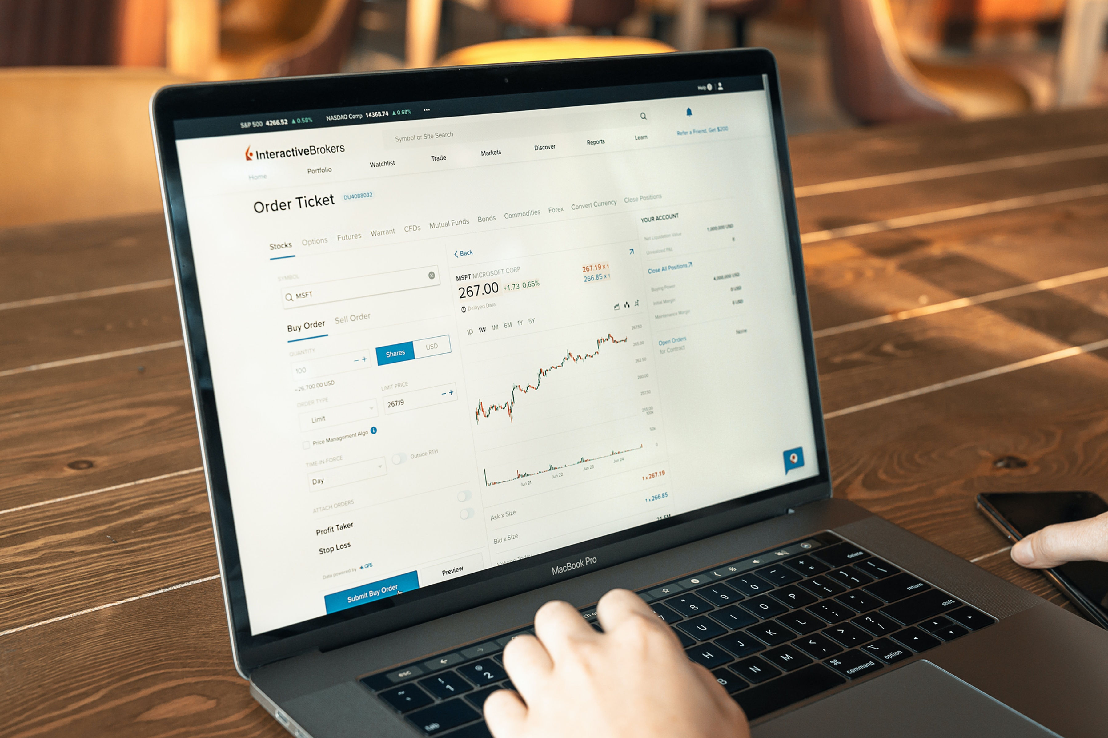 Product demo showing a SaaS dashboard on a laptop