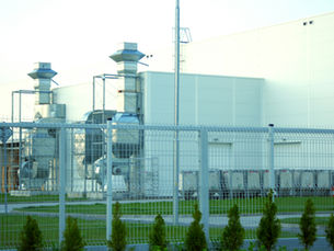 Industrial green methanol production plant with renewable energy inputs, electrolyzers and storage tanks producing low-carbon methanol fuel for maritime shipping.